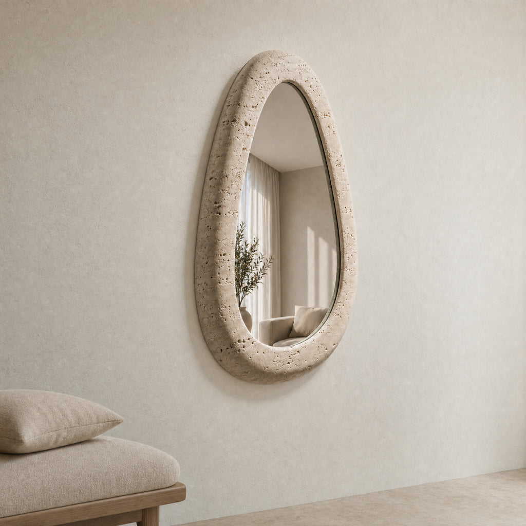 Riflesso stone-framed mirror installed in a calm warm-white interior.