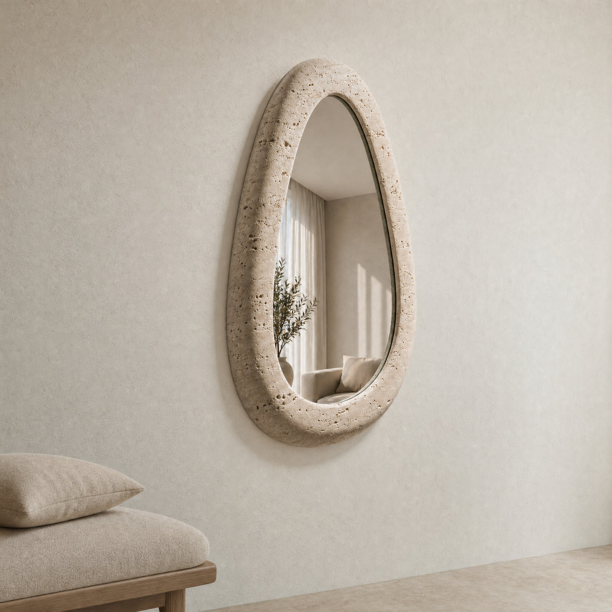 Riflesso stone-framed mirror installed in a calm warm-white interior.